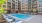 swimming pool surrounded by lounge chairs